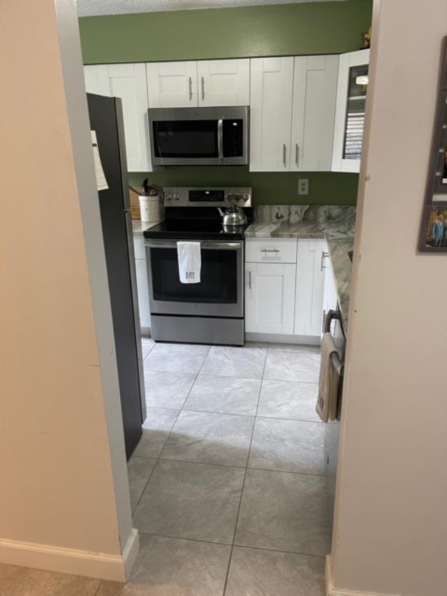 6006 Indrio Road, Unit 3 Fort Pierce, FL 34951 - Photo 4 of 17 s kitchen 2