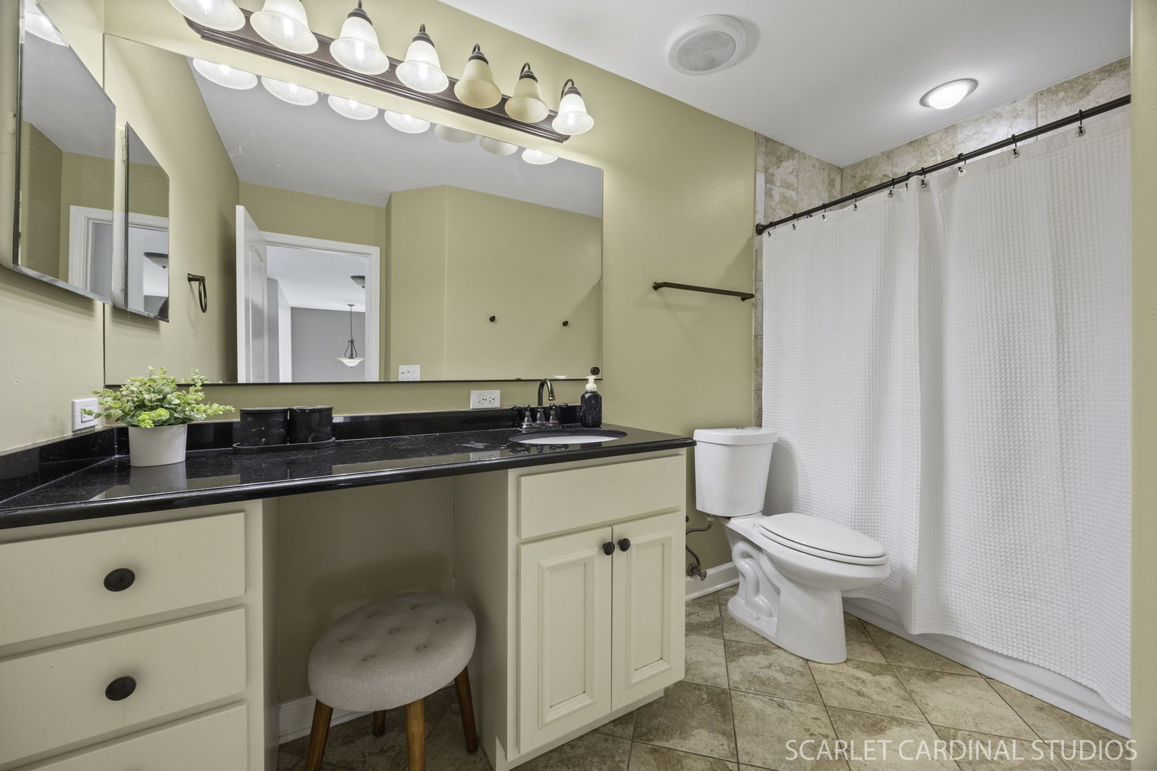 227 Faircroft Road Bartlett, IL 60103 - Photo 16 of 22 a bathroom with a granite countertop sink a toilet a mirror and shower