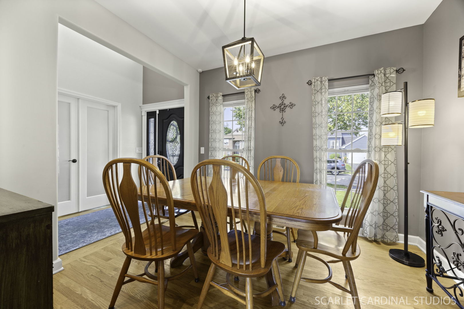 227 Faircroft Road Bartlett, IL 60103 - Photo 8 of 22 a dining room with furniture a chandelier and wooden floor