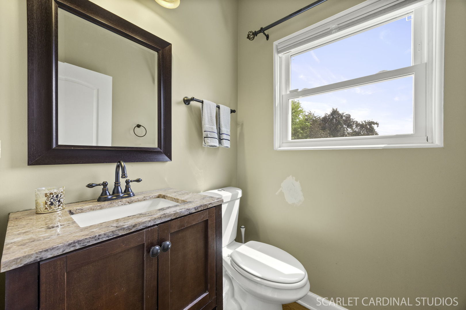 227 Faircroft Road Bartlett, IL 60103 - Photo 10 of 22 a bathroom with a granite countertop toilet a sink and mirror