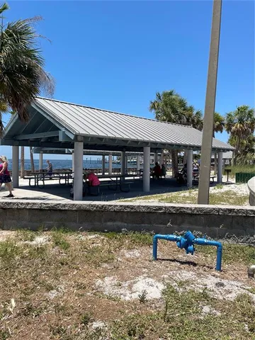 a view of a swimming pool with outdoor seating