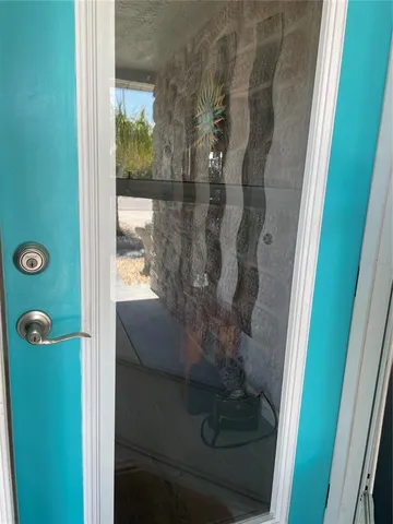 a bathroom with a glass shower door