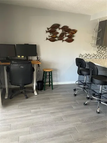 a view of a workspace with furniture