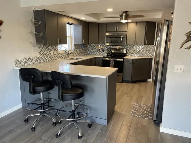 a view of a kitchen and dining room