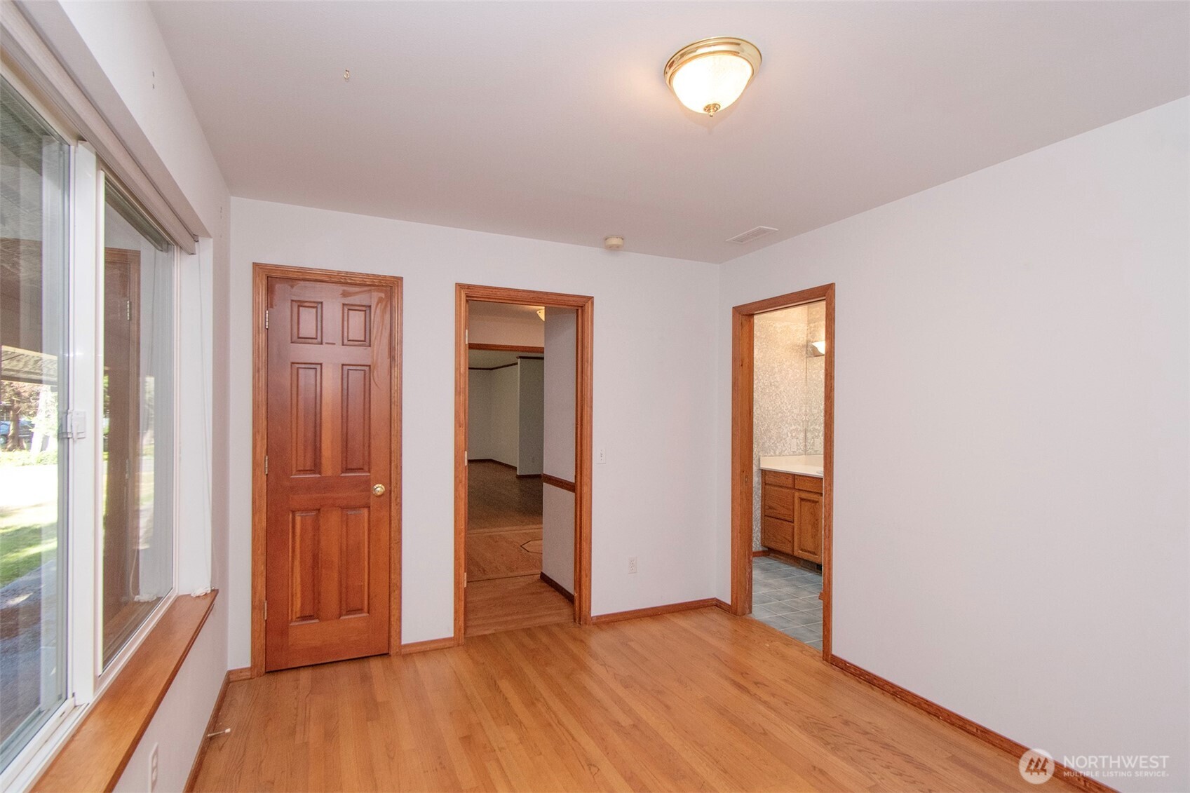 99 South Point Road Port Angeles, WA 98363 - Photo 25 of 40 wooden floor in an empty room with a window