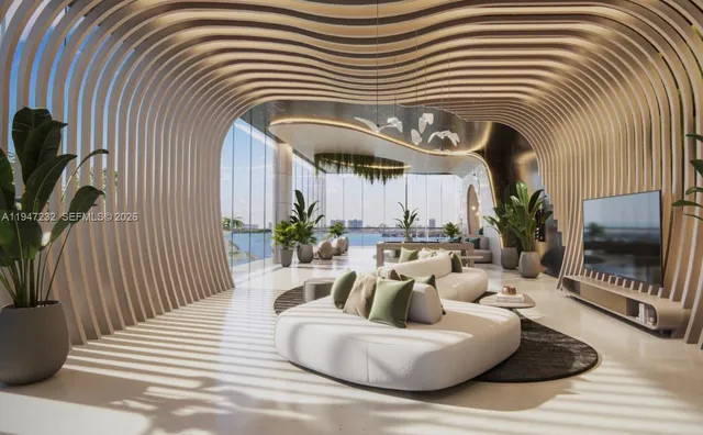 a living room with furniture and a floor to ceiling window