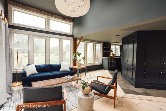 a view of a dining room with furniture window and outside view