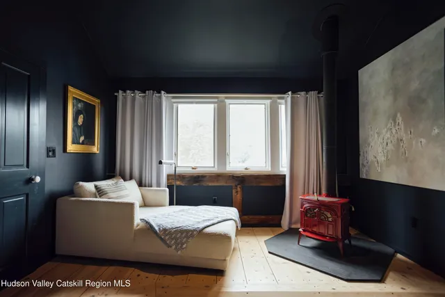 a kitchen with a sink and large window
