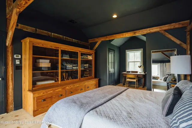 a bedroom with furniture and window