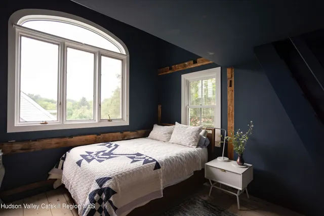 a view of room with window and flat screen tv