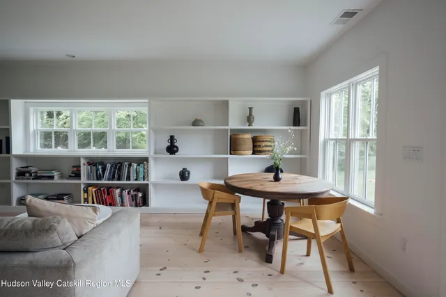 a living room with furniture and a table