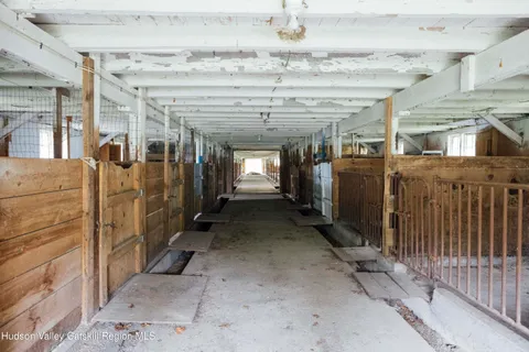 a front view of a house with a yard table and chairs