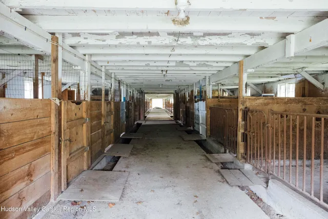 a front view of a house with a yard table and chairs