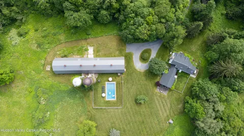 a view of a house with a swimming pool