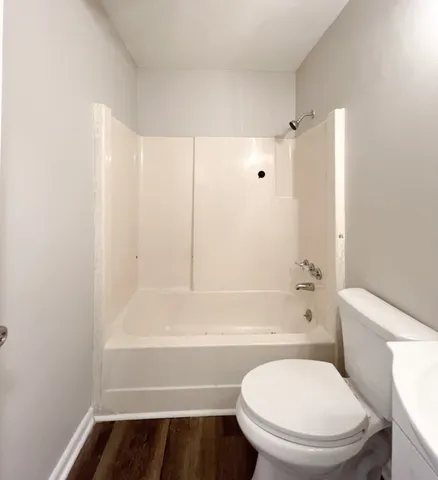 a bathroom with a toilet and a bathtub
