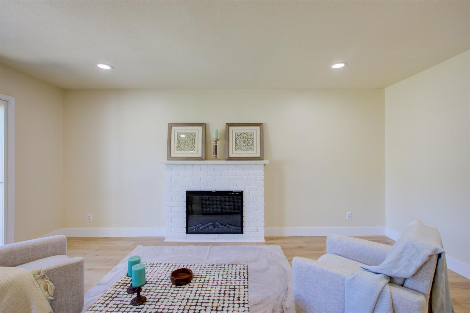 1673 Sacramento Drive Merced, CA 95348 - Photo 11 of 35 a living room with furniture and a fireplace