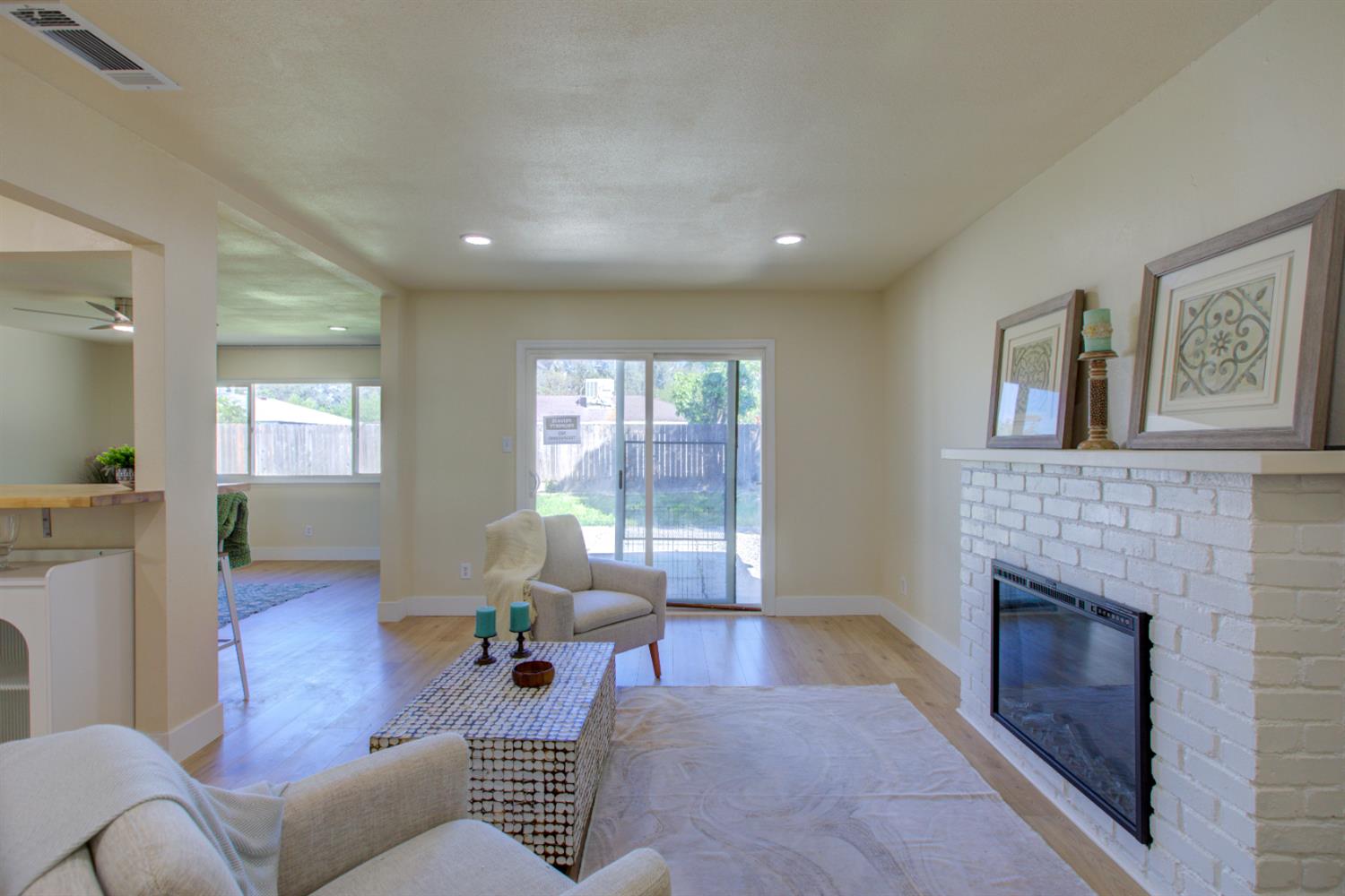 1673 Sacramento Drive Merced, CA 95348 - Photo 12 of 35 a living room with furniture and a fireplace