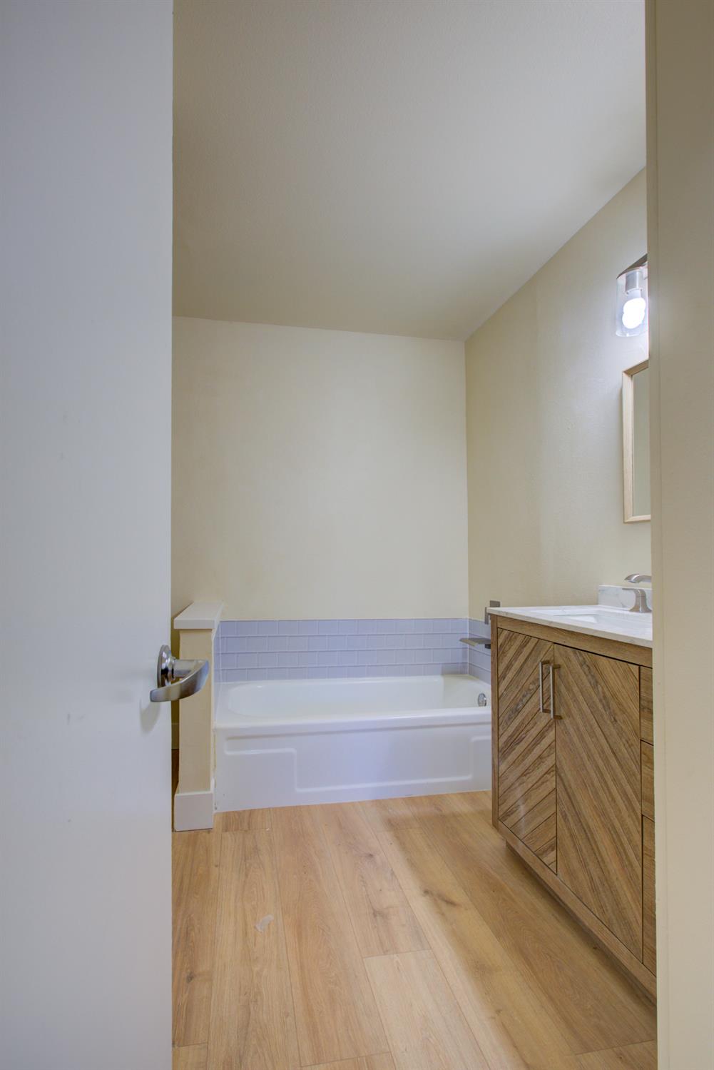 1673 Sacramento Drive Merced, CA 95348 - Photo 18 of 35 a bathroom with a bathtub