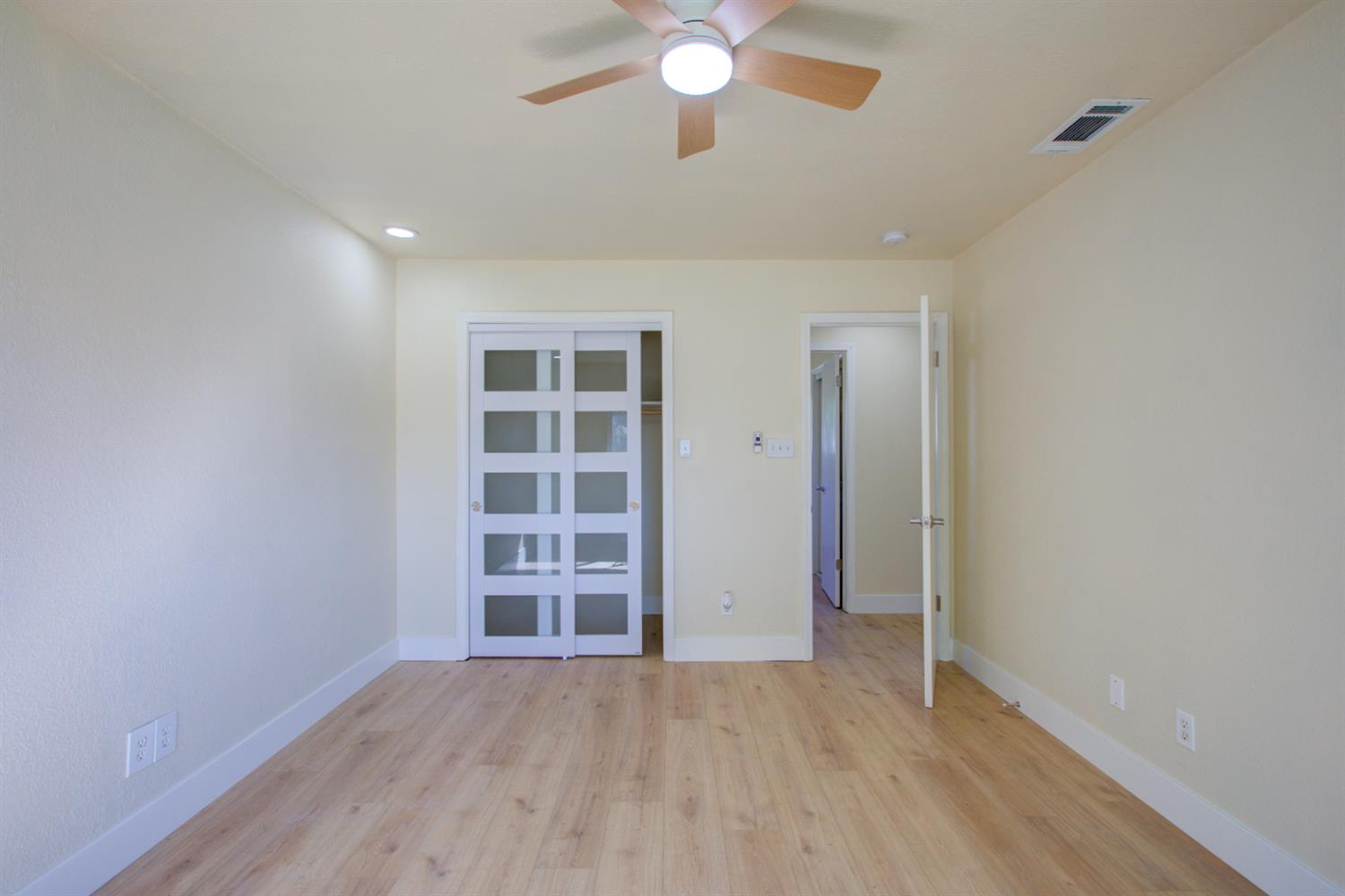1673 Sacramento Drive Merced, CA 95348 - Photo 19 of 35 an empty room with a empty space and windows