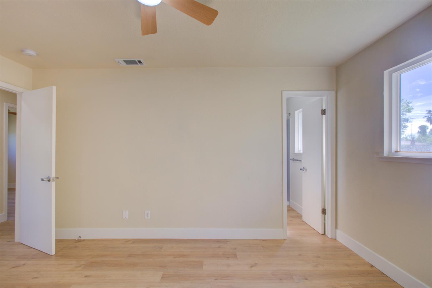 1673 Sacramento Drive Merced, CA 95348 - Photo 20 of 35 an empty room with windows and closet