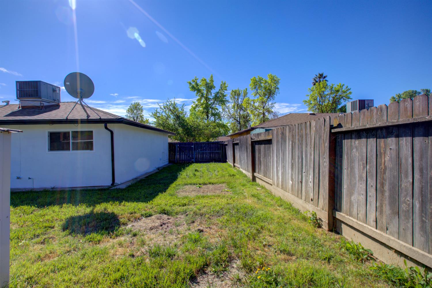 1673 Sacramento Drive Merced, CA 95348 - Photo 25 of 35 a view of a backyard with pathway