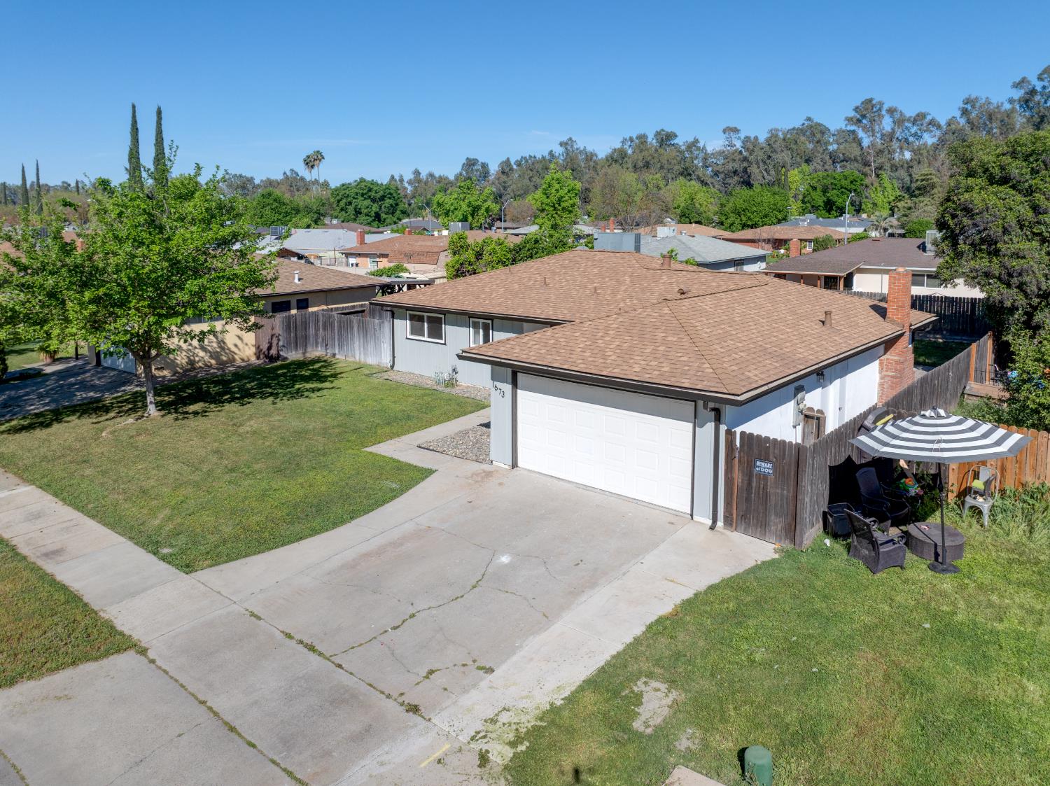 1673 Sacramento Drive Merced, CA 95348 - Photo 30 of 35 a aerial view of a house with a yard table and chairs