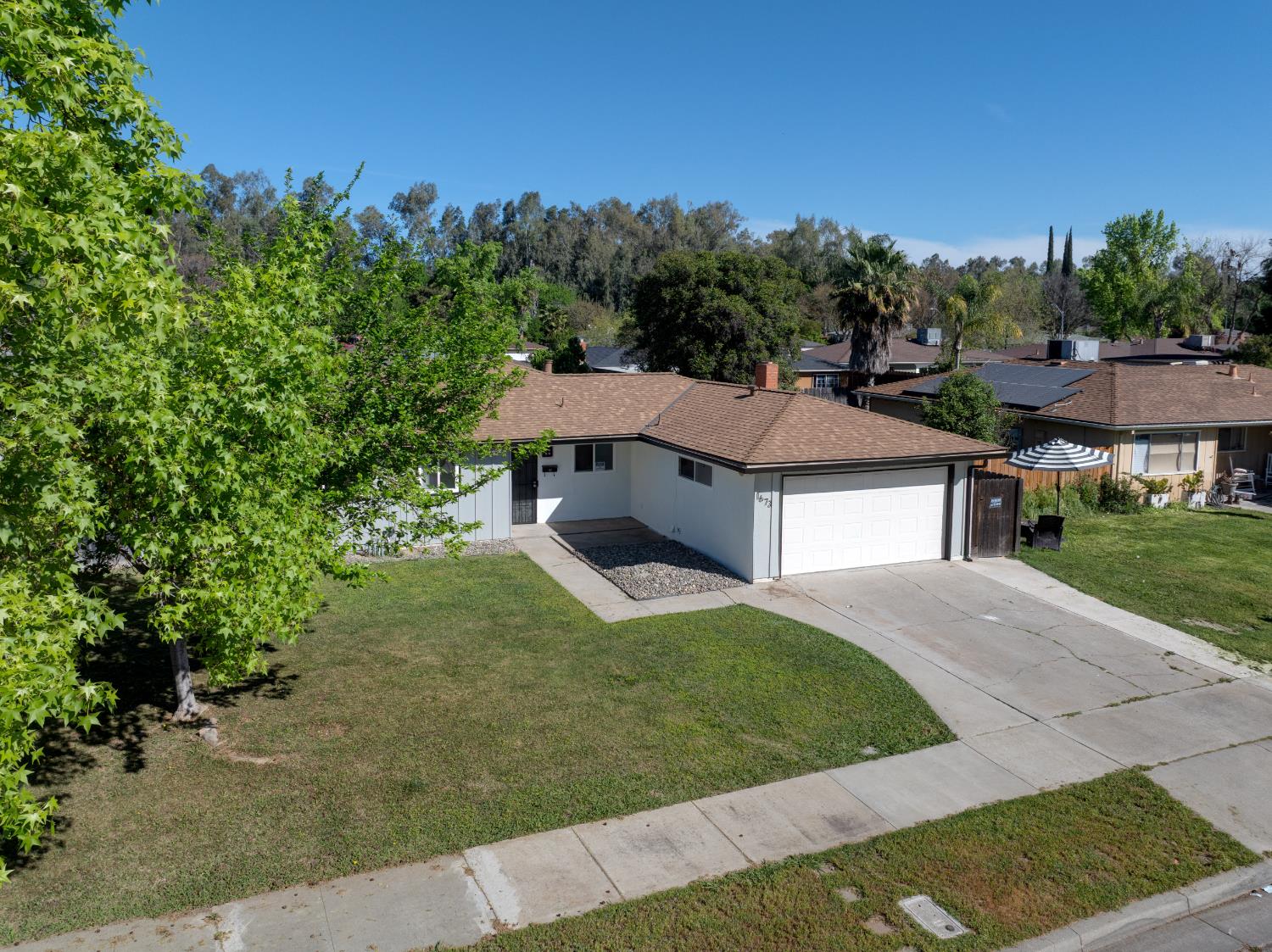 1673 Sacramento Drive Merced, CA 95348 - Photo 31 of 35 front view of a house with a yard