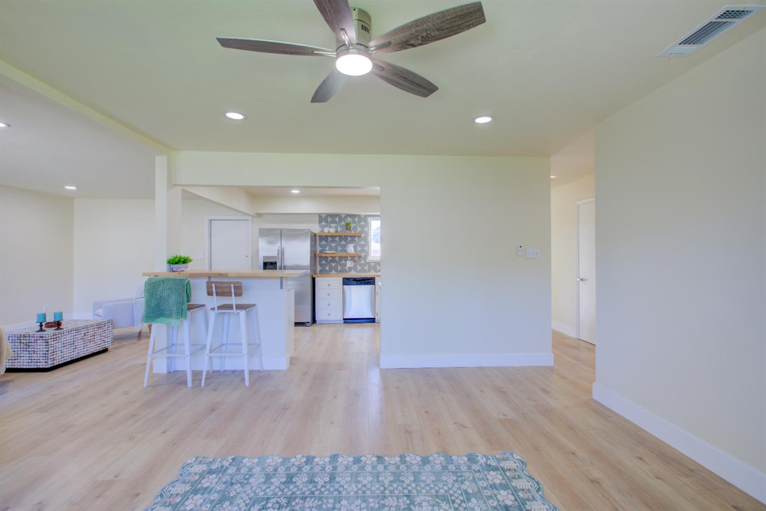 1673 Sacramento Drive Merced, CA 95348 - Photo 10 of 35 a living room with furniture and a wooden floor