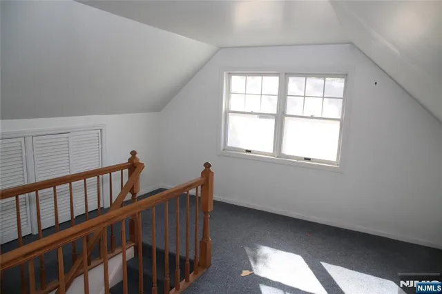 a view of an empty room with windows