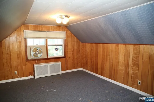 a view of a hallway with entryway door