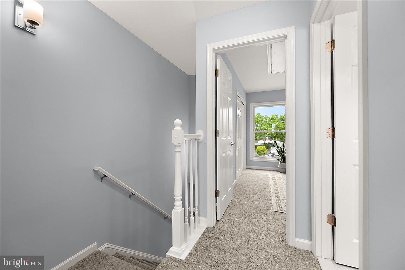 135 Jamestown Road, Unit 18A Ocean City, MD 21842 - Photo 27 of 63 a view of a hallway with wooden floor and a bathroom