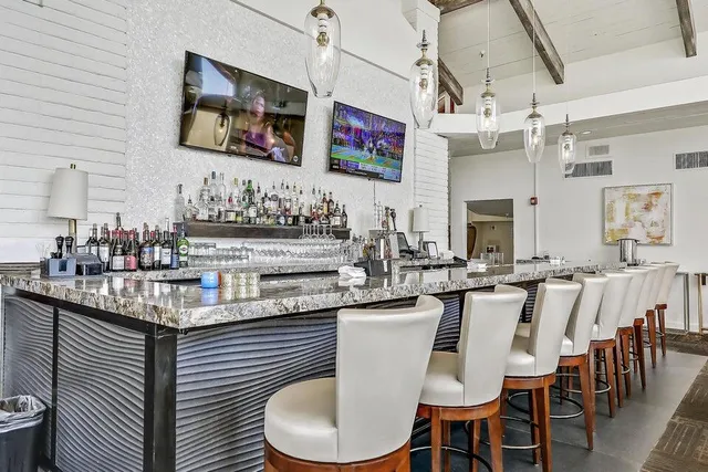 a kitchen with stainless steel appliances granite countertop a sink and cabinets