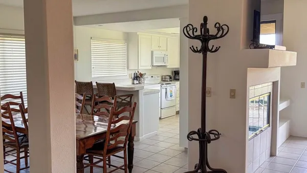 a view of a livingroom with furniture and a window
