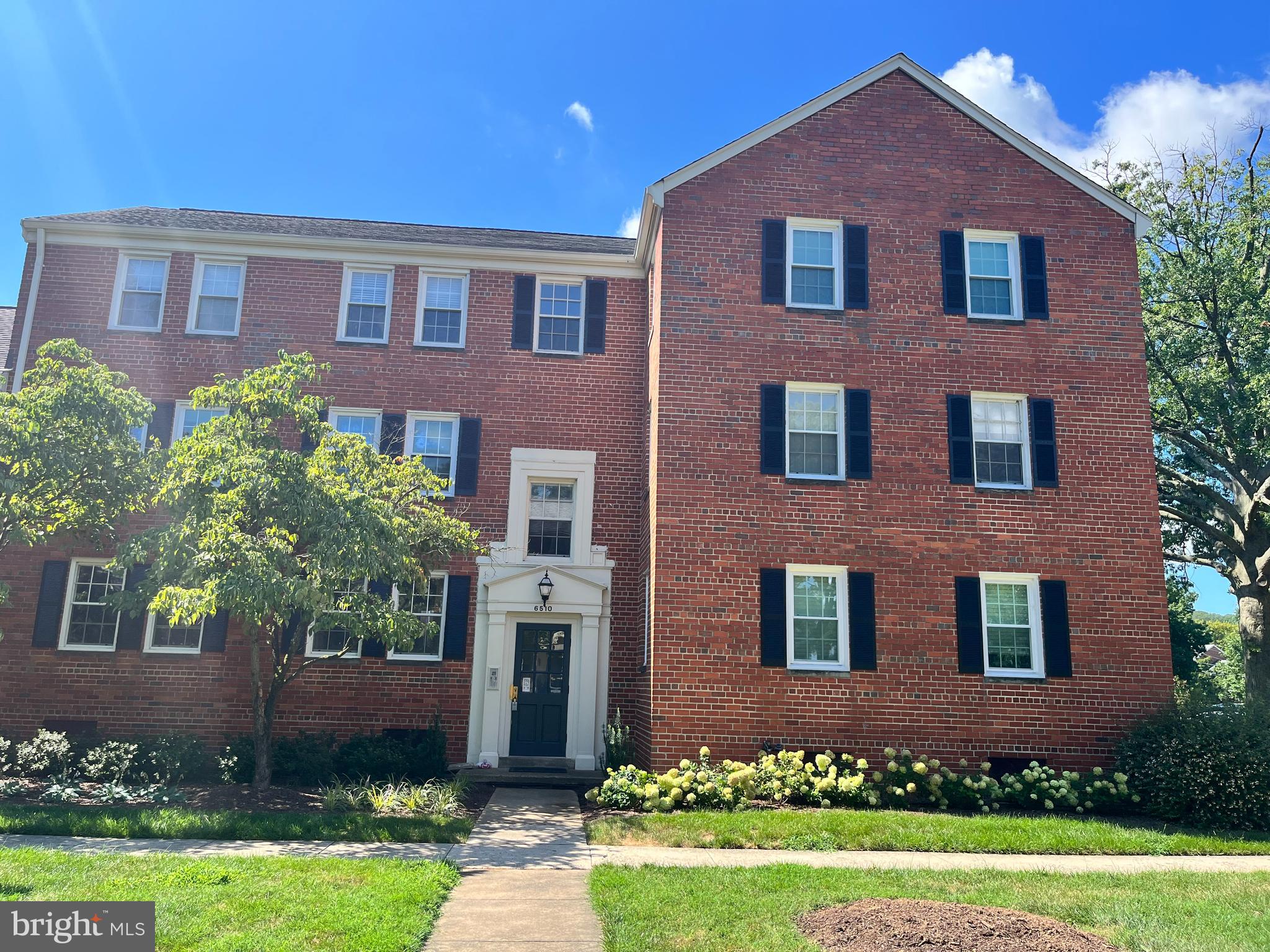 6510 Potomac Avenue, Unit C2 Alexandria, VA 22307 - Photo 1 of 15 front view of brick house with a yard
