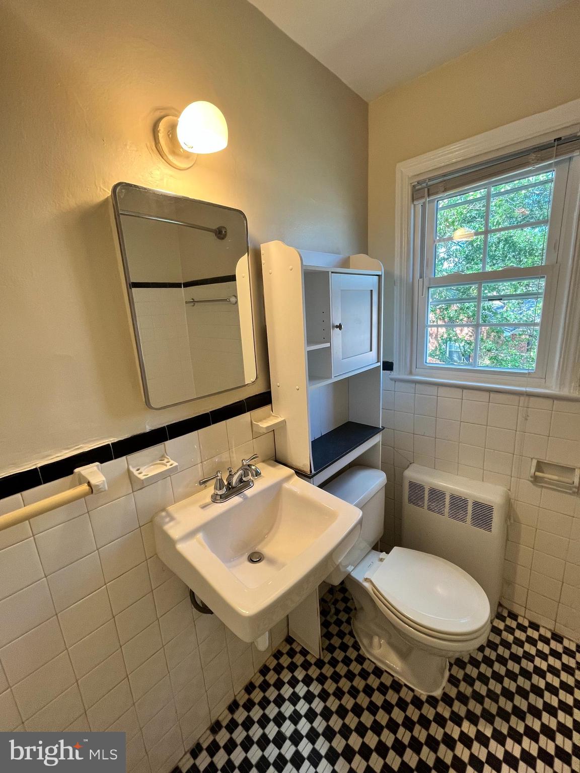 6510 Potomac Avenue, Unit C2 Alexandria, VA 22307 - Photo 12 of 15 a bathroom with a sink toilet and mirror