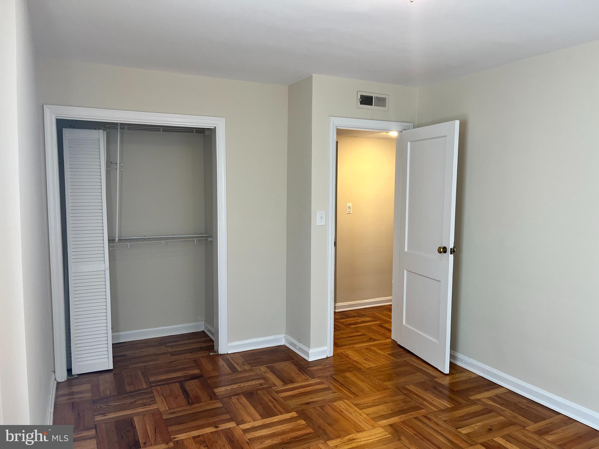 6510 Potomac Avenue, Unit C2 Alexandria, VA 22307 - Photo 9 of 15 a view of an empty room with wooden floor and a bathroom