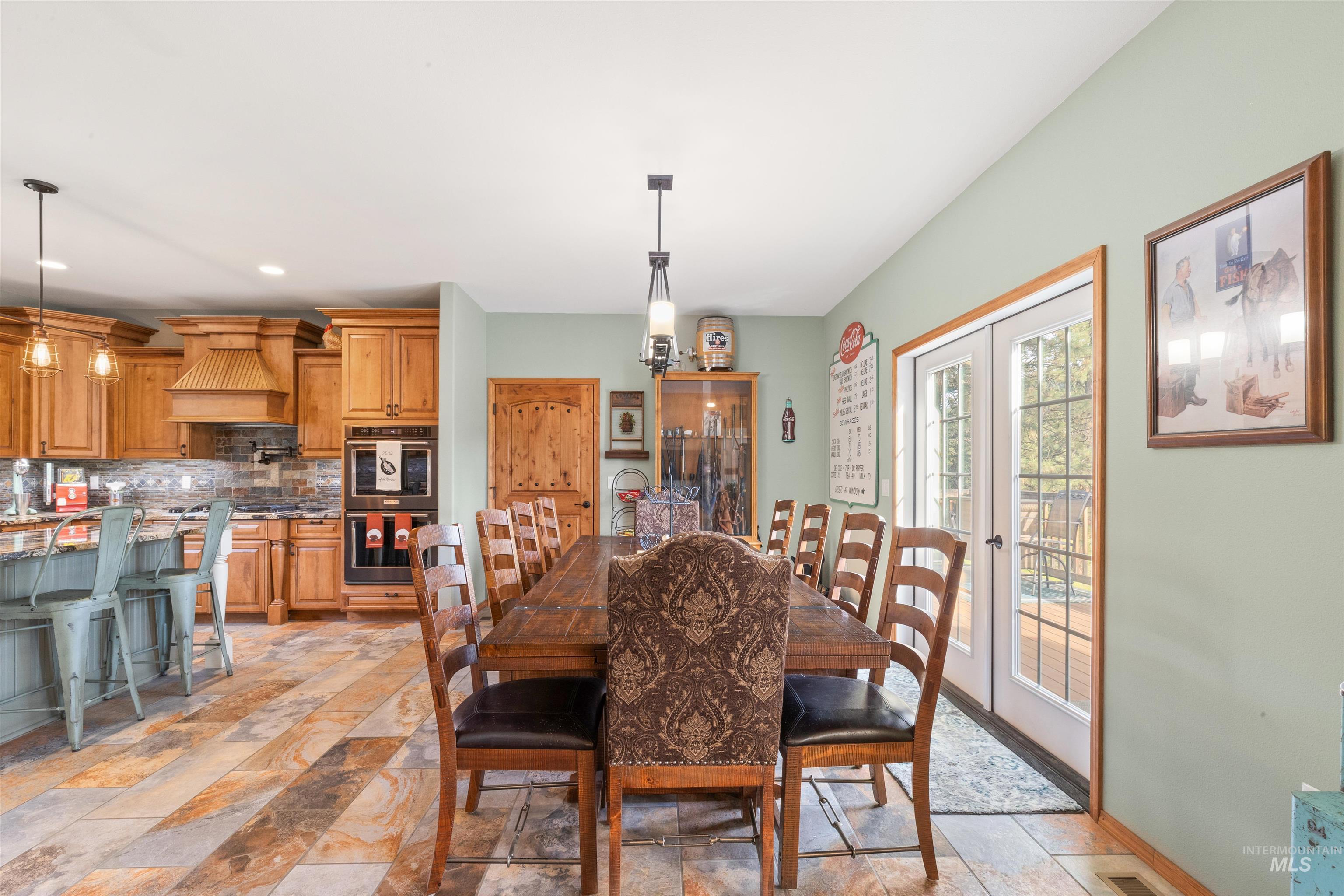 643 Adams Road Orofino, ID 83544 - Photo 11 of 50 Dining area featuring light stone finish flooring, french doors, and recessed lighting