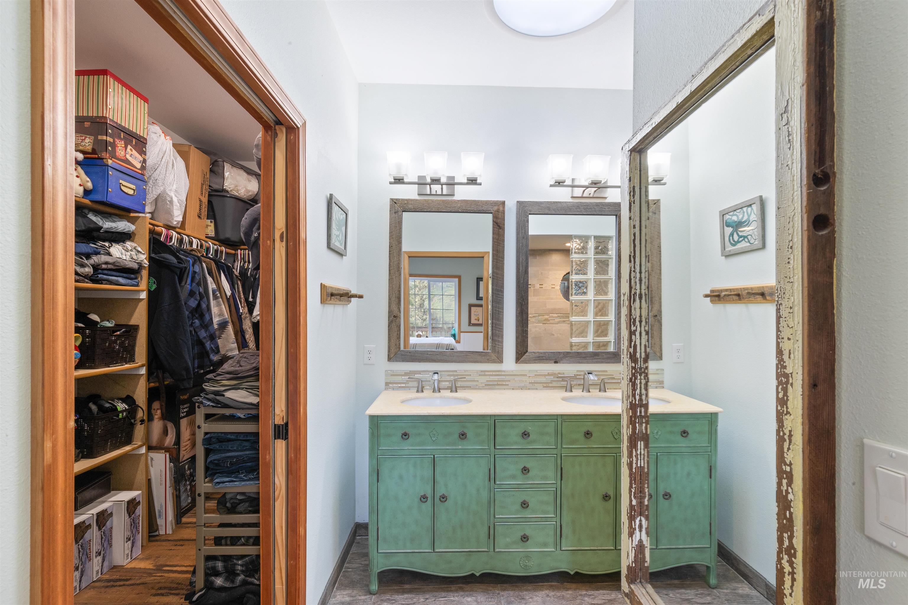 643 Adams Road Orofino, ID 83544 - Photo 20 of 50 Full bathroom featuring double vanity and a walk in closet