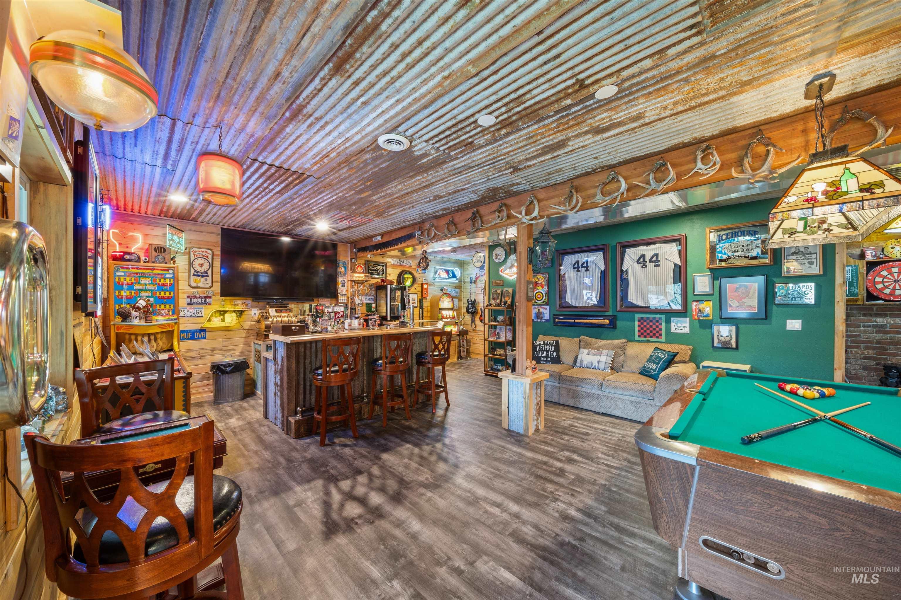 643 Adams Road Orofino, ID 83544 - Photo 24 of 50 Recreation room with billiards table, a community bar, wood walls, and wood ceiling