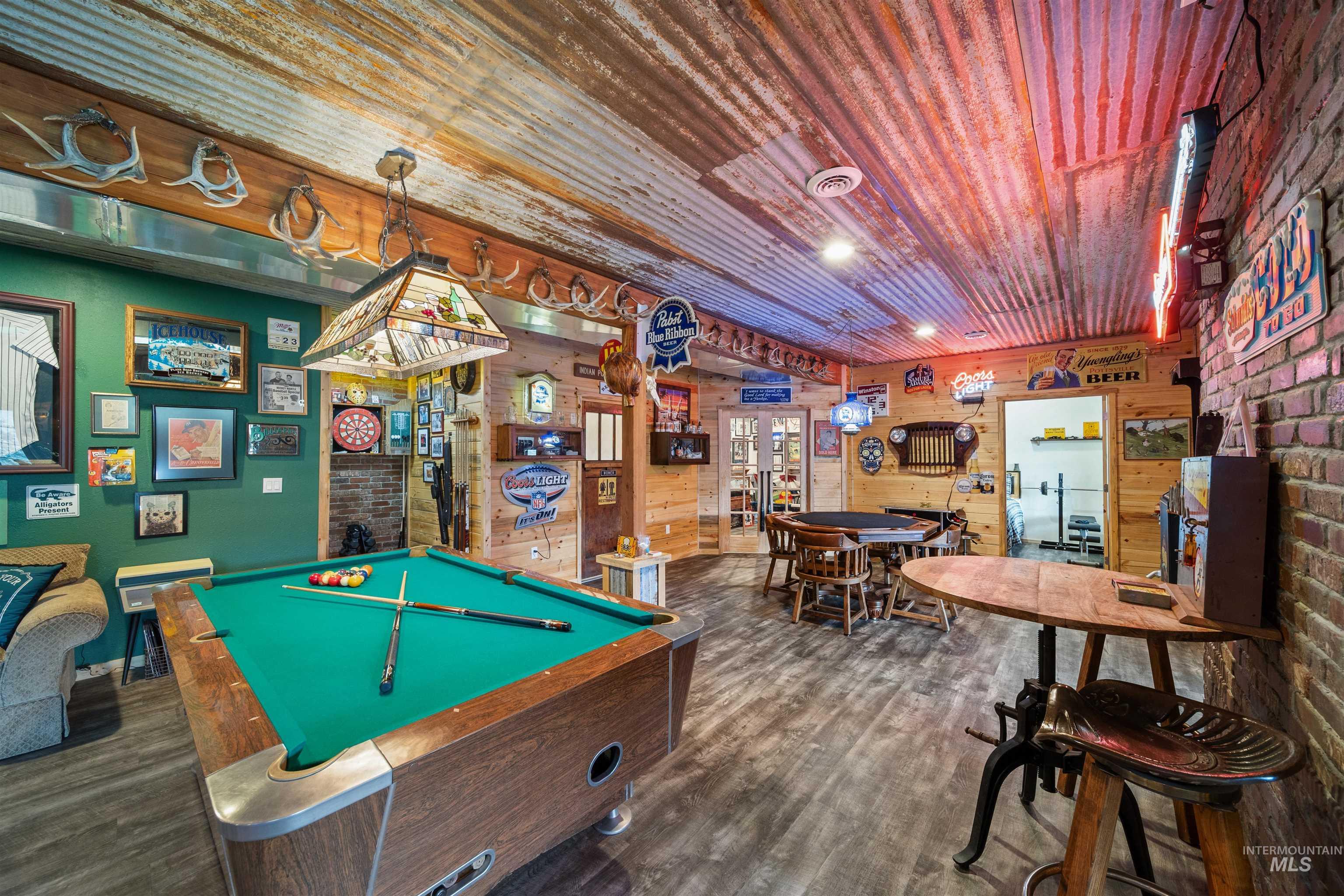 643 Adams Road Orofino, ID 83544 - Photo 25 of 50 Rec room with pool table, wood walls, and wooden ceiling