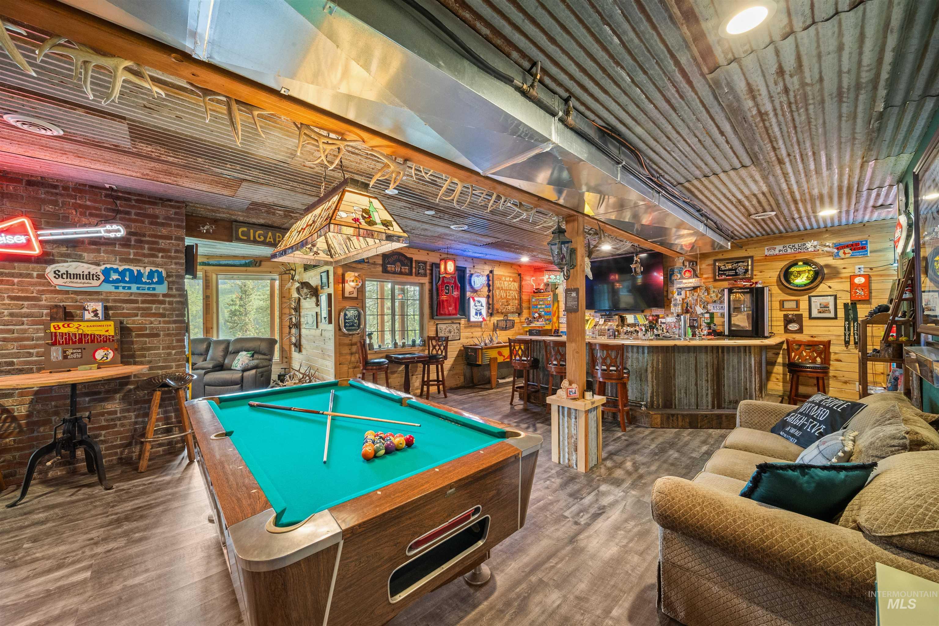 643 Adams Road Orofino, ID 83544 - Photo 27 of 50 Game room featuring a dry bar, wooden walls, billiards table, and wood finished floors