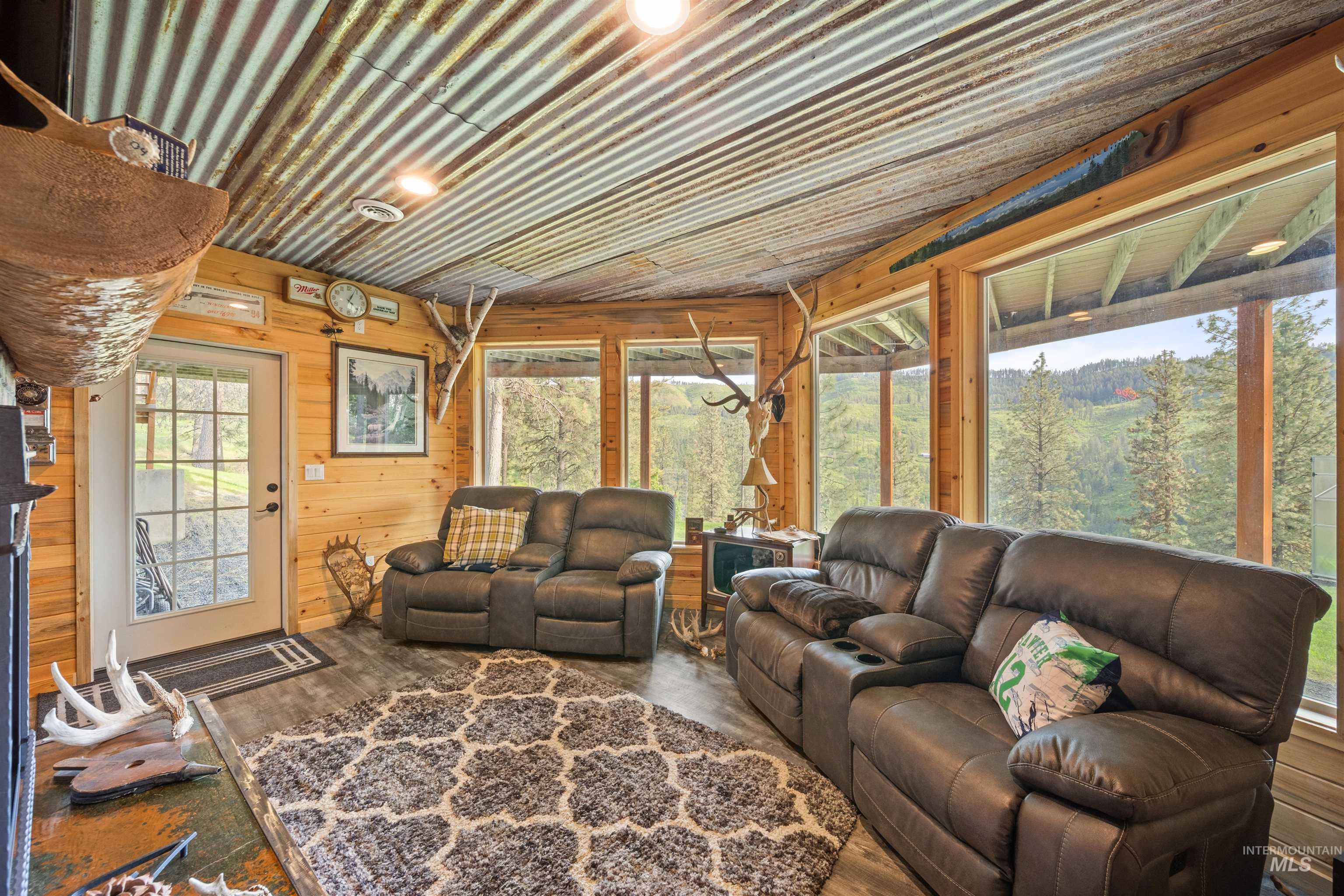643 Adams Road Orofino, ID 83544 - Photo 29 of 50 Living area featuring wooden walls