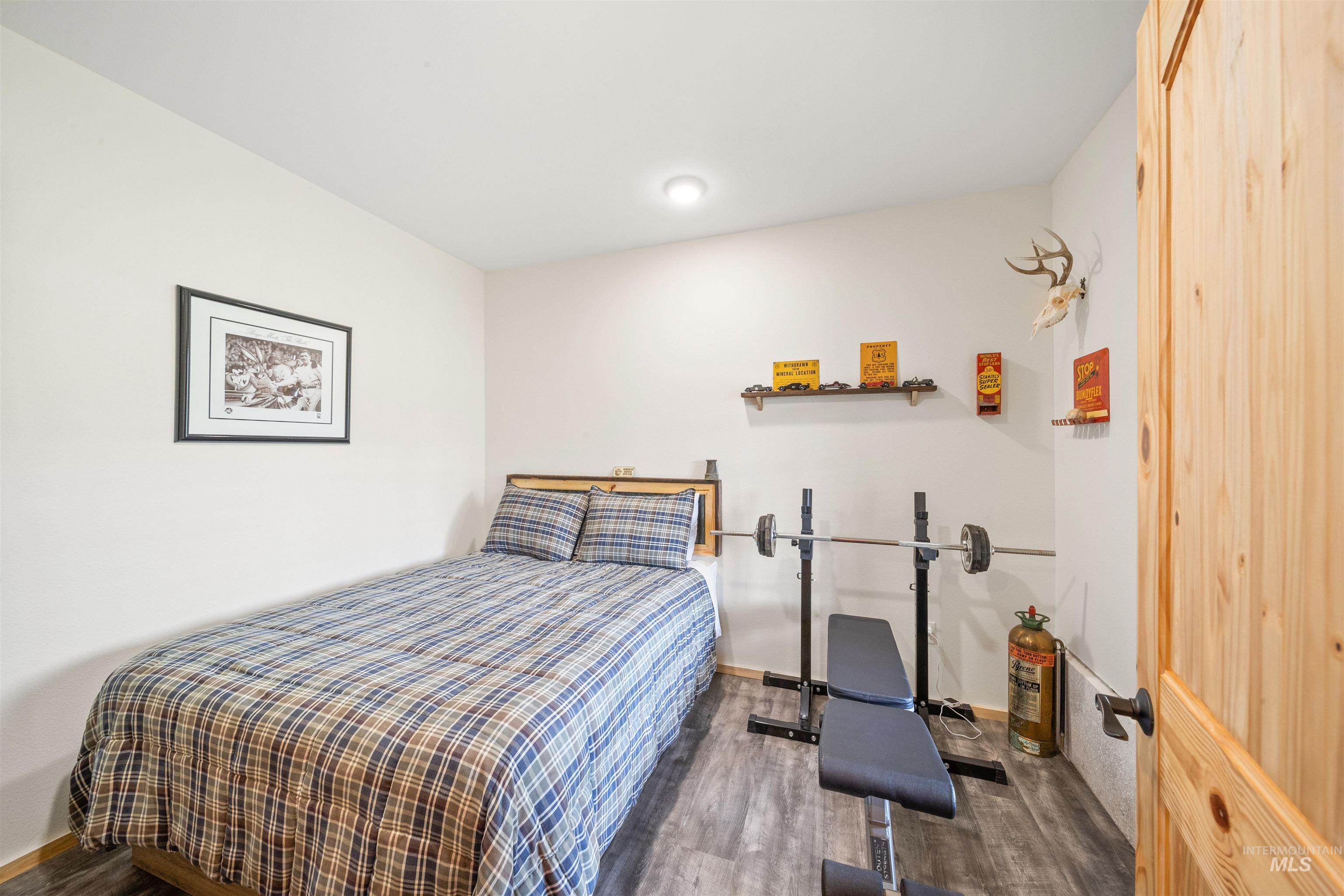 643 Adams Road Orofino, ID 83544 - Photo 34 of 50 Bedroom featuring wood finished floors and baseboards