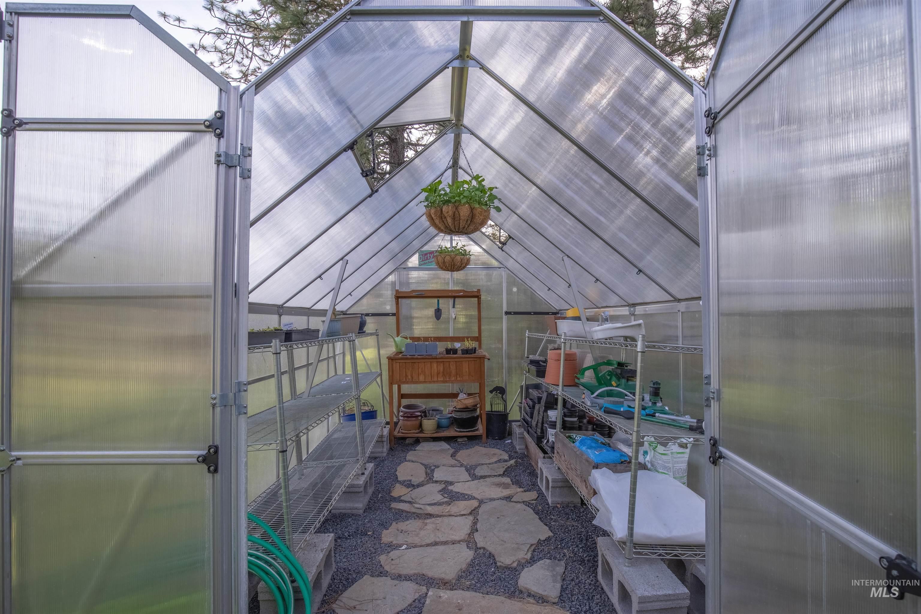 643 Adams Road Orofino, ID 83544 - Photo 37 of 50 View of patio featuring an exterior structure and an outbuilding