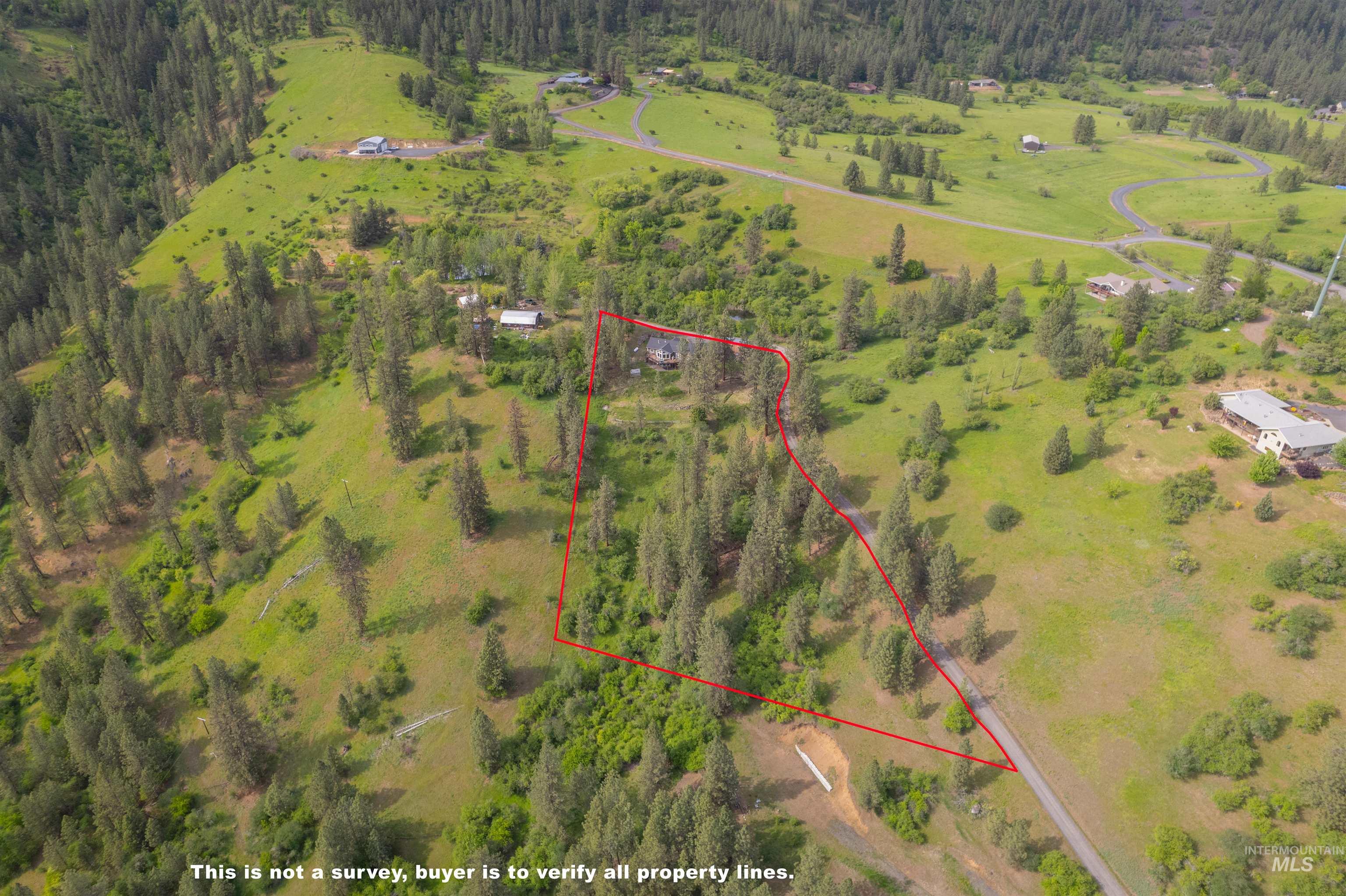643 Adams Road Orofino, ID 83544 - Photo 48 of 50 Overview of rural landscape featuring a forest and property parcel outlined