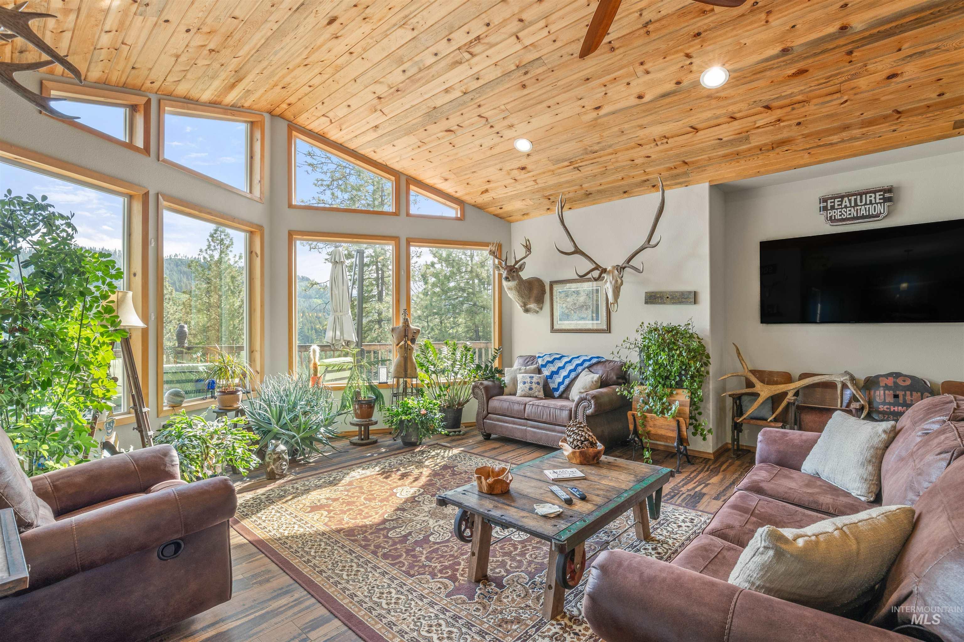 643 Adams Road Orofino, ID 83544 - Photo 6 of 50 Living area with a vaulted wood ceiling, wood finished floors, recessed lighting, and ceiling fan