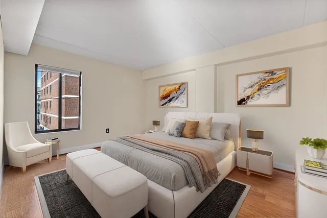 a spacious bedroom with a bed and a couch