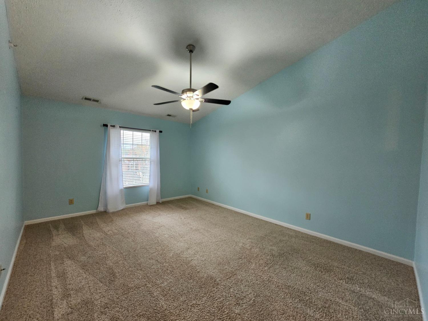 4331 Regency Ridge Court, Unit 306 Cincinnati, OH 45248 - Photo 19 of 45 Spacious primary bedroom with vaulted ceiling.