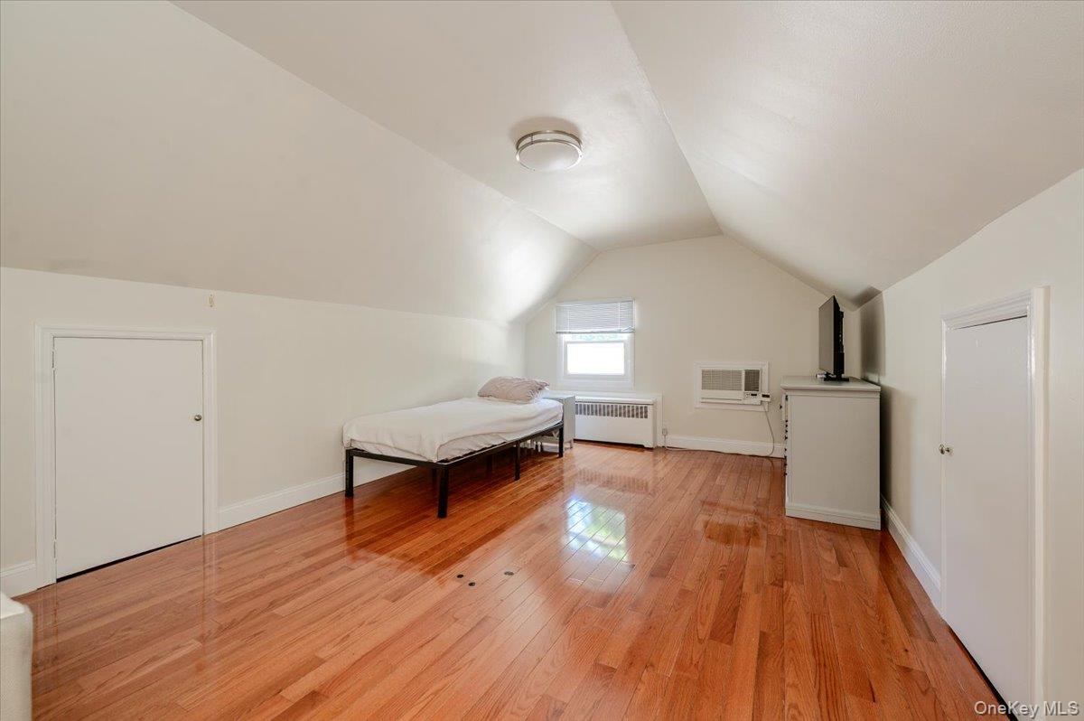 70 Longfellow Road Great Neck, NY 11023 - Photo 23 of 28 a view of a living room hardwood and kitchen with wooden floor