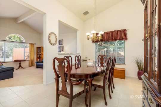 1217 Flora Way Ridgecrest, CA 93555 - Photo 11 of 39 a dining room with furniture a livingroom and chandelier